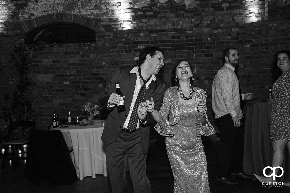 Guests dancing to the sounds of Jumping Jukebox at the Old Cigar Warehouse reception.