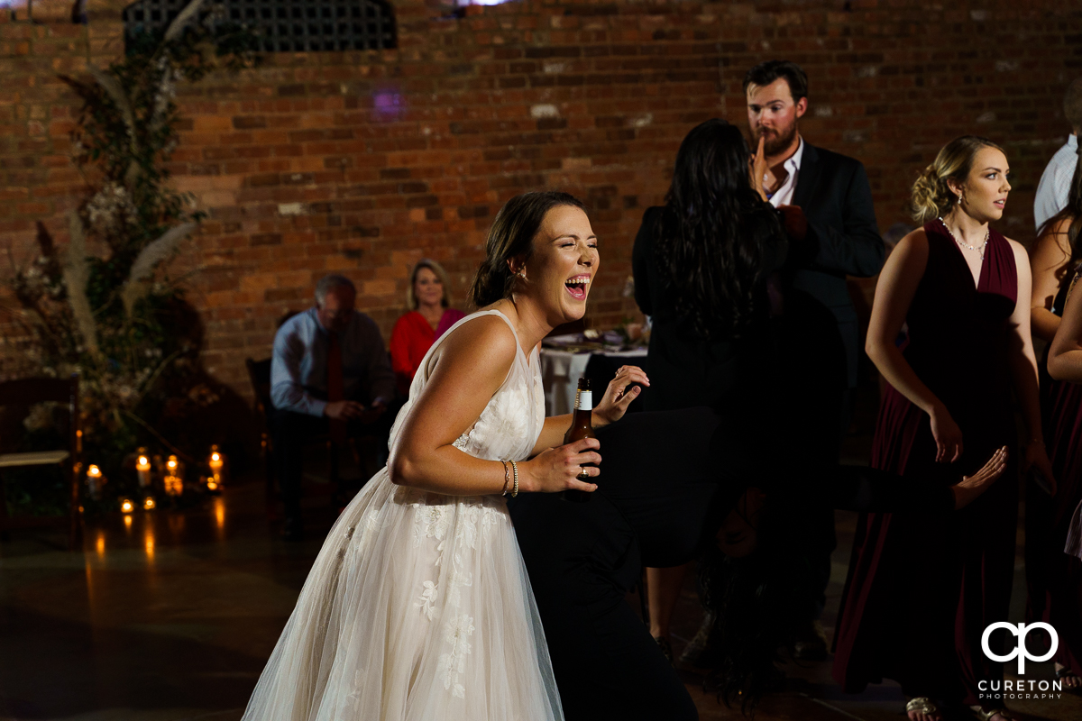 Guests dancing to the sounds of Jumping Jukebox at the reception.