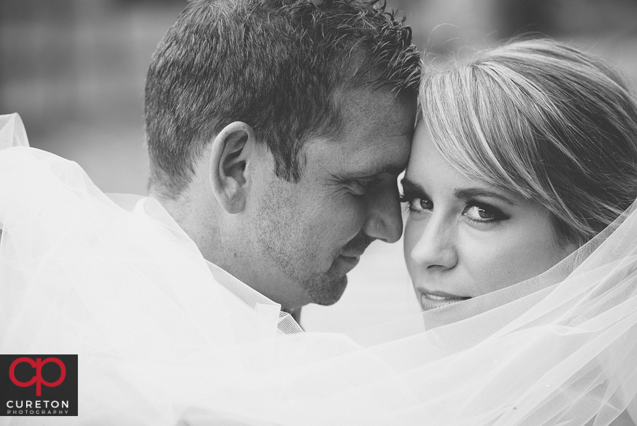 Black and white closeup of a bride and groom.