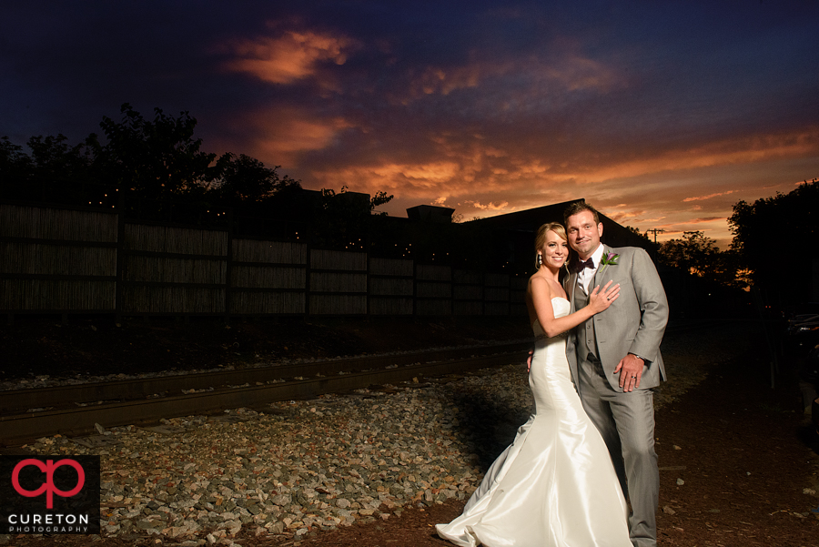 Bride and groom at sunset.