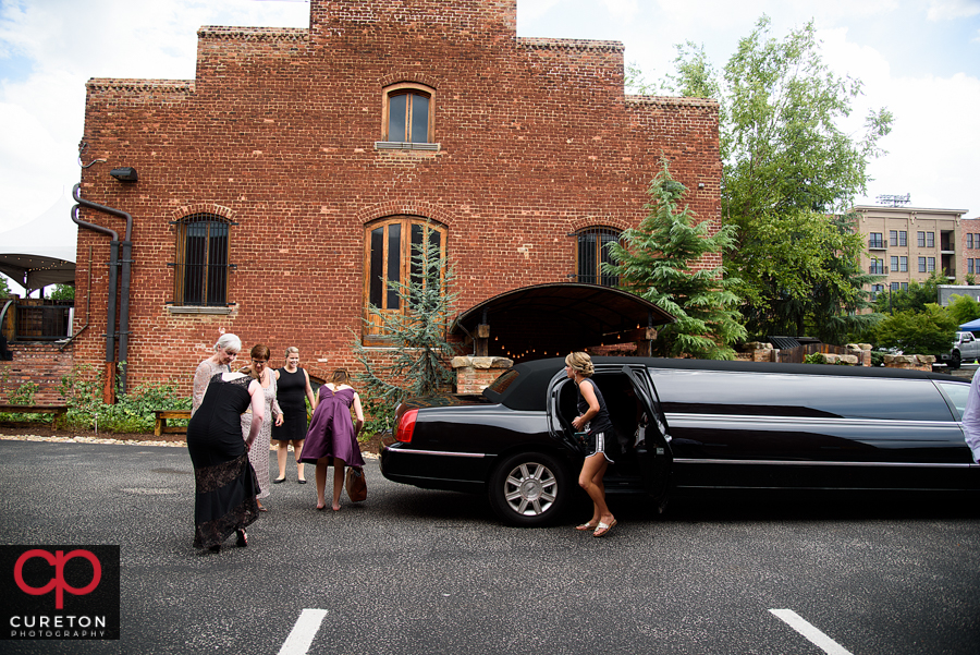 Bride getting out of a limo.