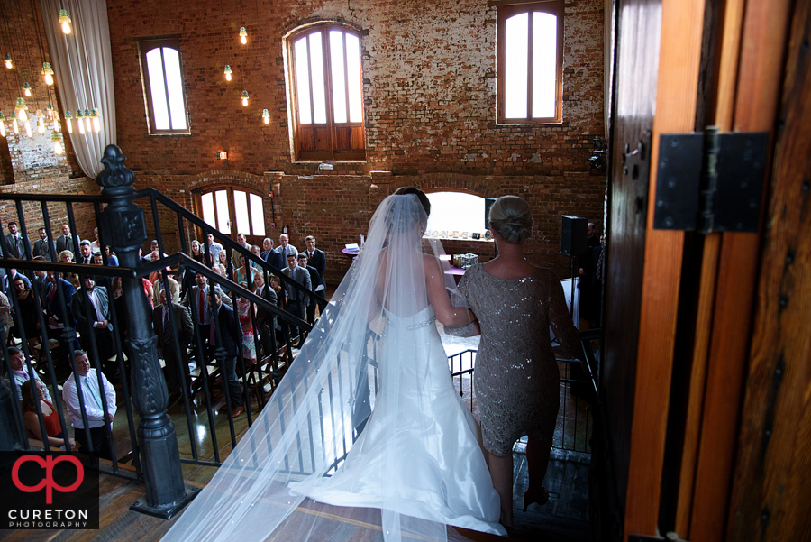 Bride walking down the stairs.