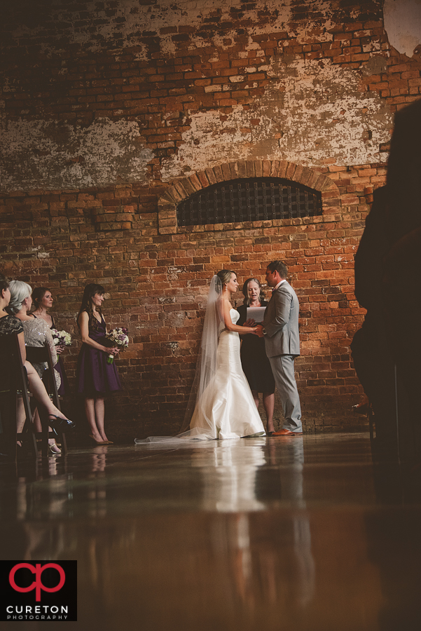 Couple at the alter during the ceremony.