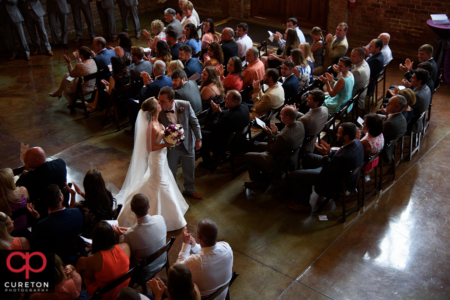 Bride and Groom walking back down the aisle.