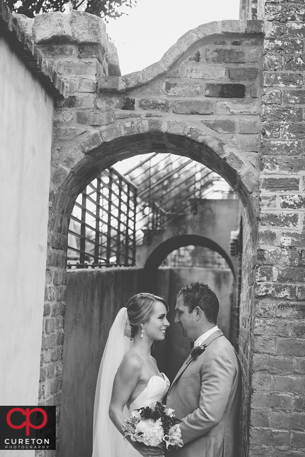 Black and white of Bride and Groom outside the Old Cigar Warehouse.