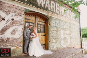Bride and Groom on the deck of the Old Cigar Warehouse.