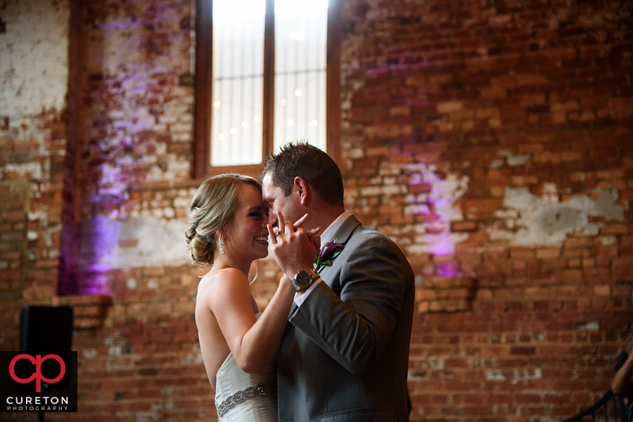 Bride and groom sharing a first dance.