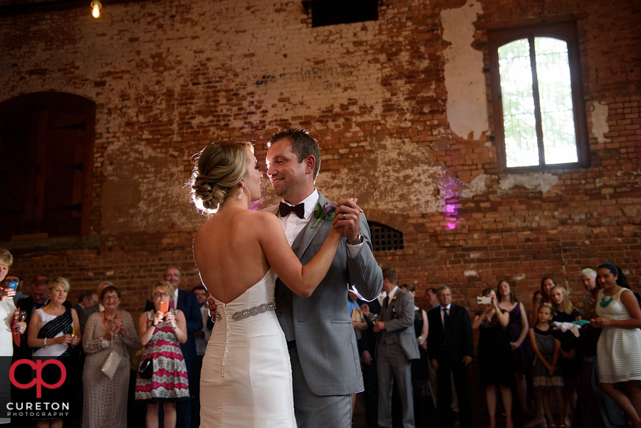 Bride and groom sharing a first dance.