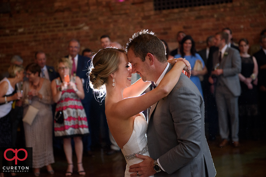 Bride and groom sharing a first dance.