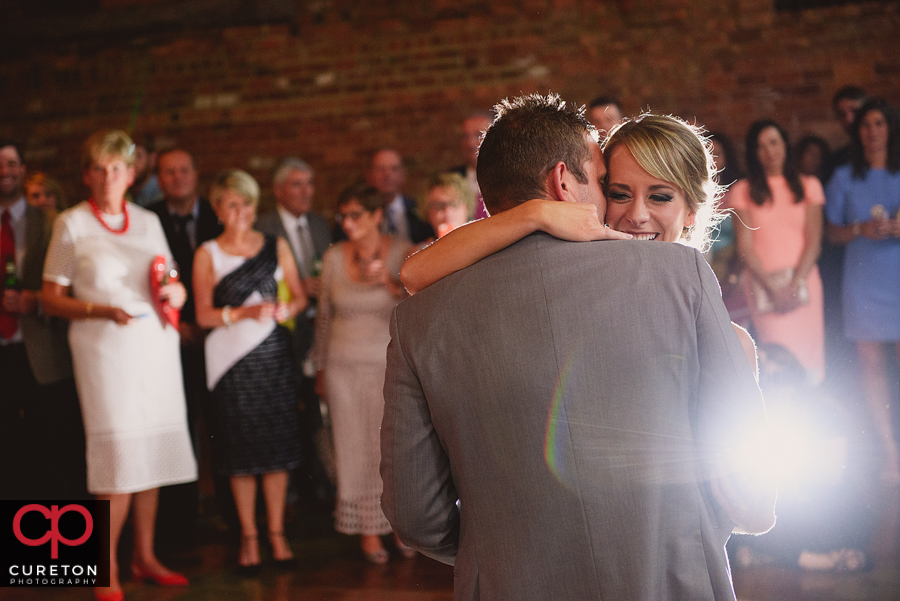 Bride and groom sharing a first dance at The Old Cigar Warehouse wedding reception.