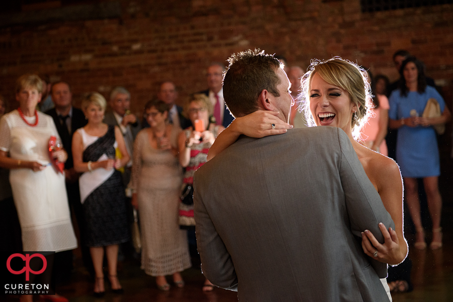 Bride and groom sharing a first dance.