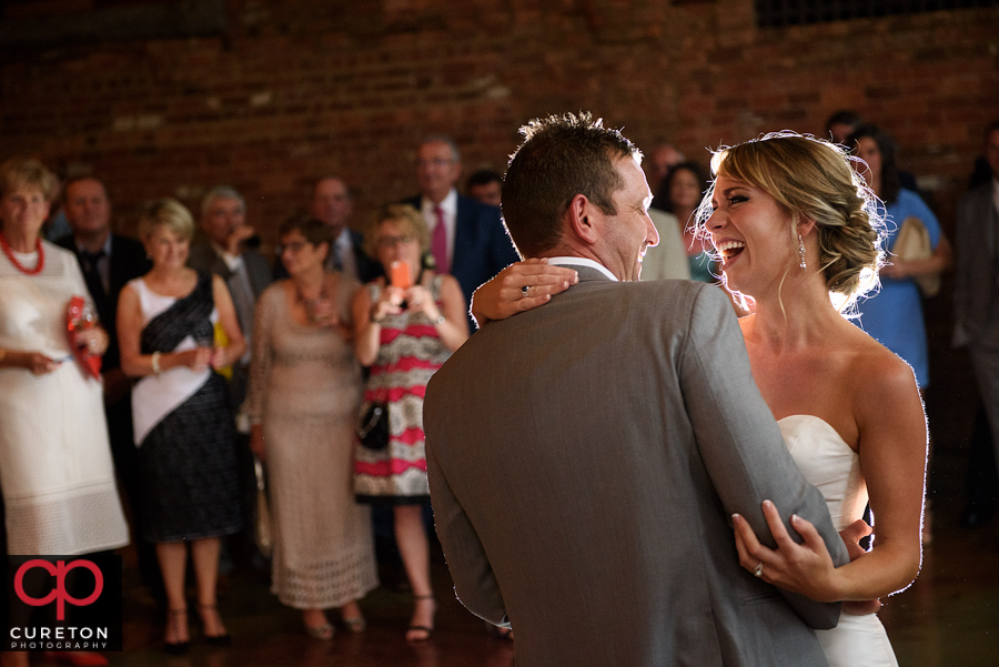 Bride and groom sharing a first dance.