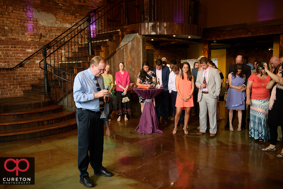 Prayer before the reception.