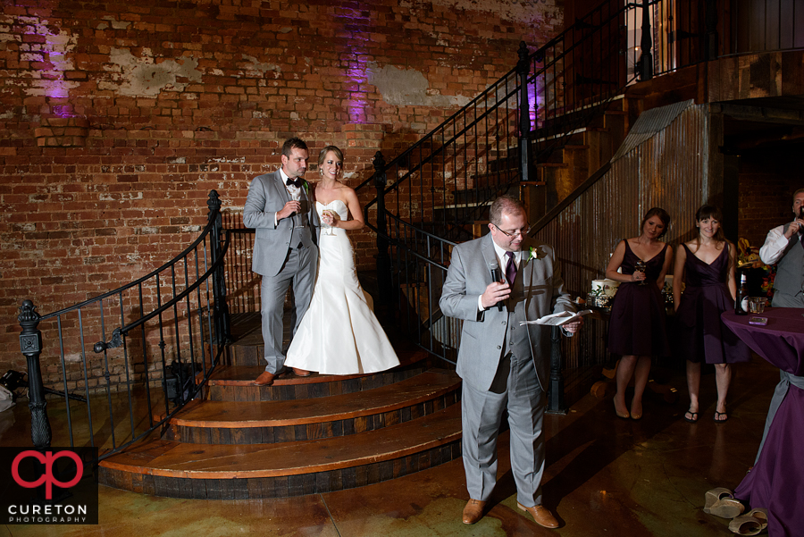 The best man giving the couple a toast.