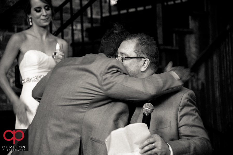 The best man giving the couple a toast.