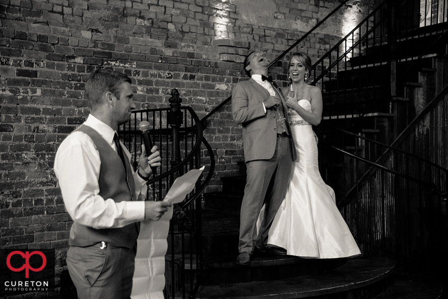 The best man giving the couple a toast.