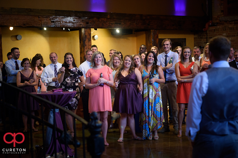 The best man giving the couple a toast.