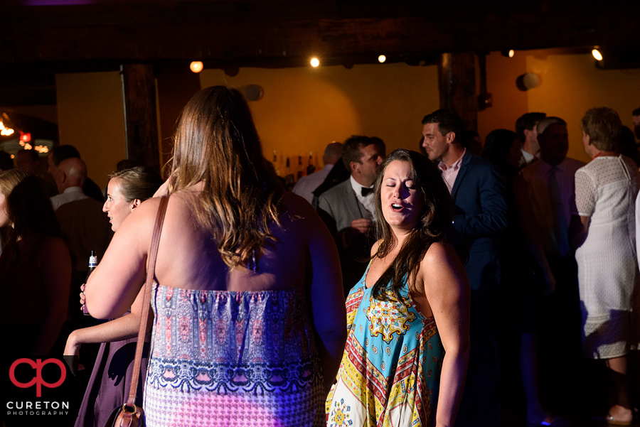 Wedding guests dancing to the sounds of Uptown Entertainment.
