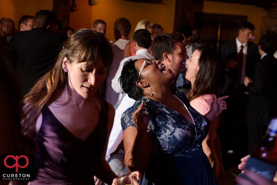 Wedding guests dancing to the sounds of Uptown Entertainment.