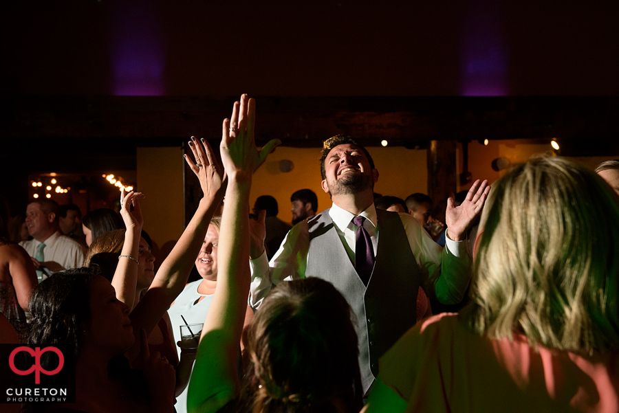 Wedding guests dancing to the sounds of Uptown Entertainment.