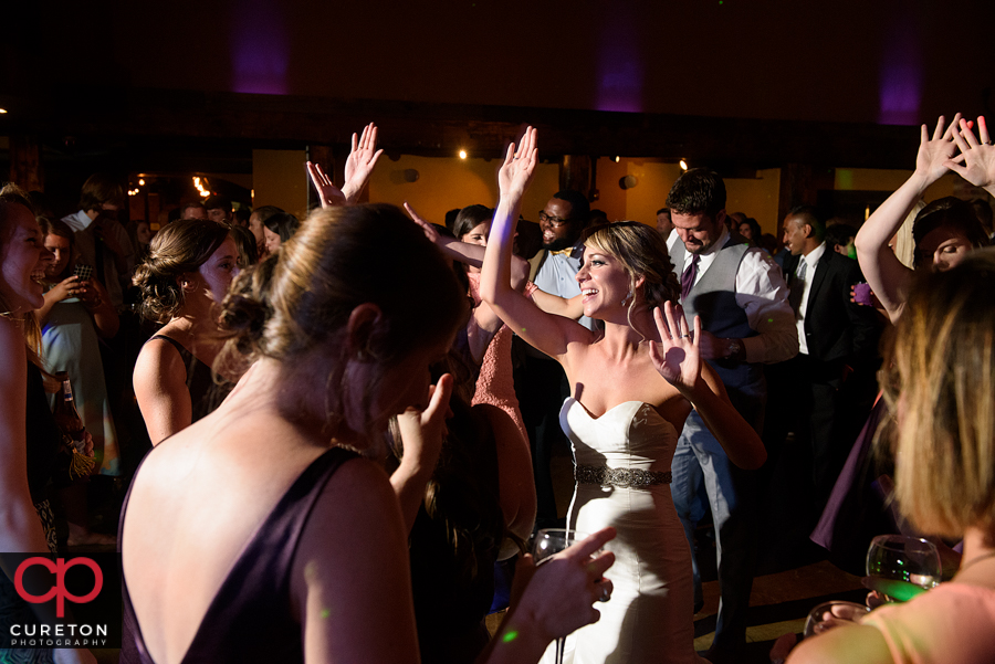 Wedding guests dancing to the sounds of Uptown Entertainment.