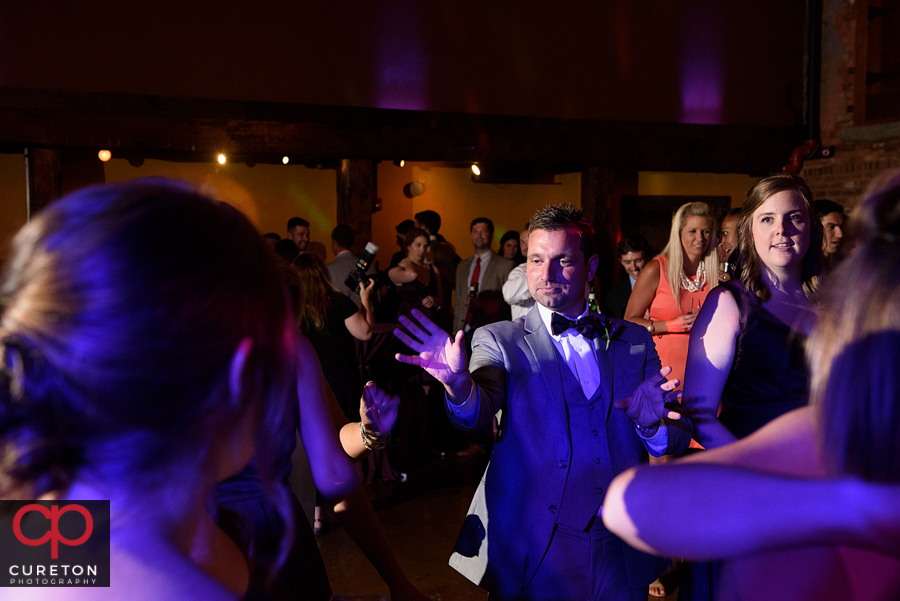 Wedding guests dancing to the sounds of Uptown Entertainment.