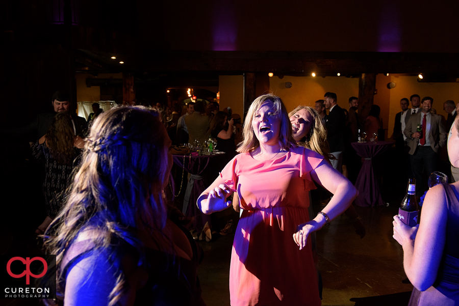 Wedding guests dancing to the sounds of Uptown Entertainment.