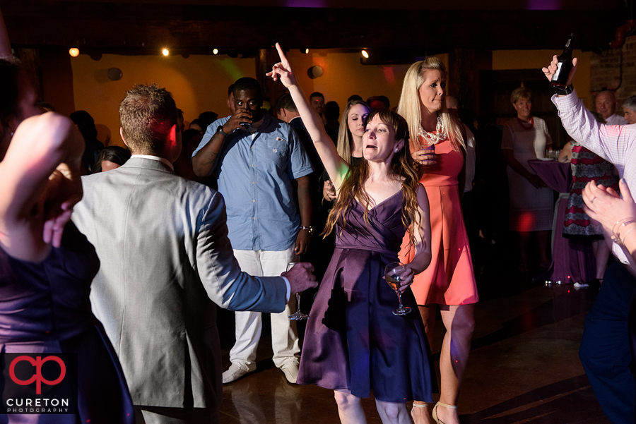 Wedding guests dancing to the sounds of Uptown Entertainment.