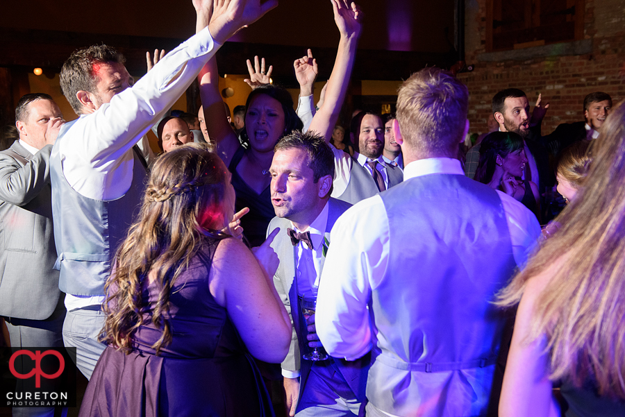 Wedding guests dancing to the sounds of Uptown Entertainment.