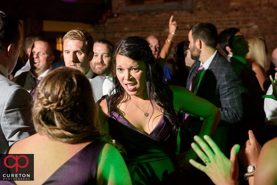 Wedding guests dancing to the sounds of Uptown Entertainment.