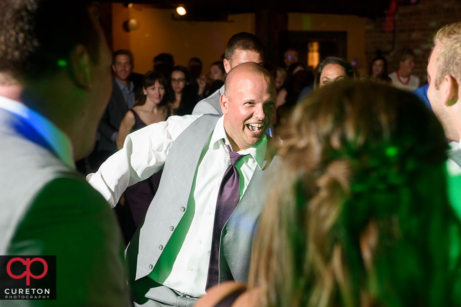 Wedding guests dancing to the sounds of Uptown Entertainment.