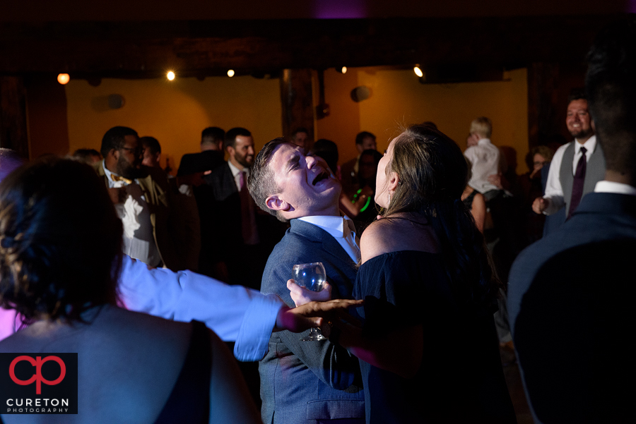 Wedding guests dancing to the sounds of Uptown Entertainment.