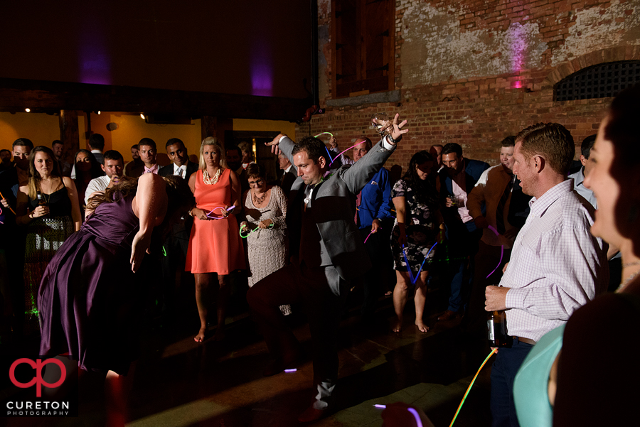 Wedding guests dancing to the sounds of Uptown Entertainment.