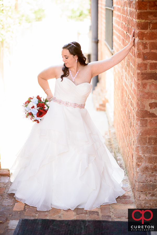 Bride pposing outside.