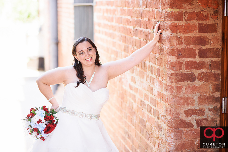 Smiling bride outside the Old Cigar Warehouse.
