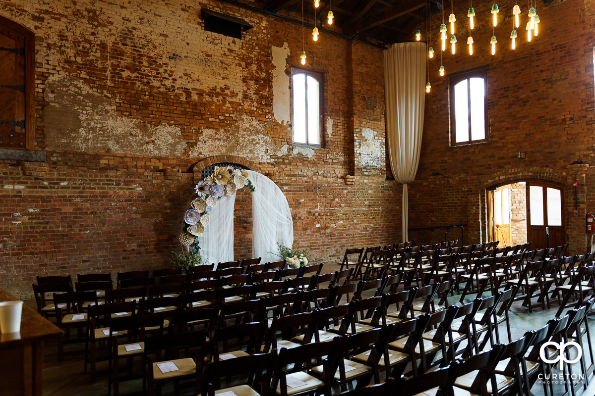 Old Cigar Warehouse setup for an indoor wedding ceremony in downtown Greenville.