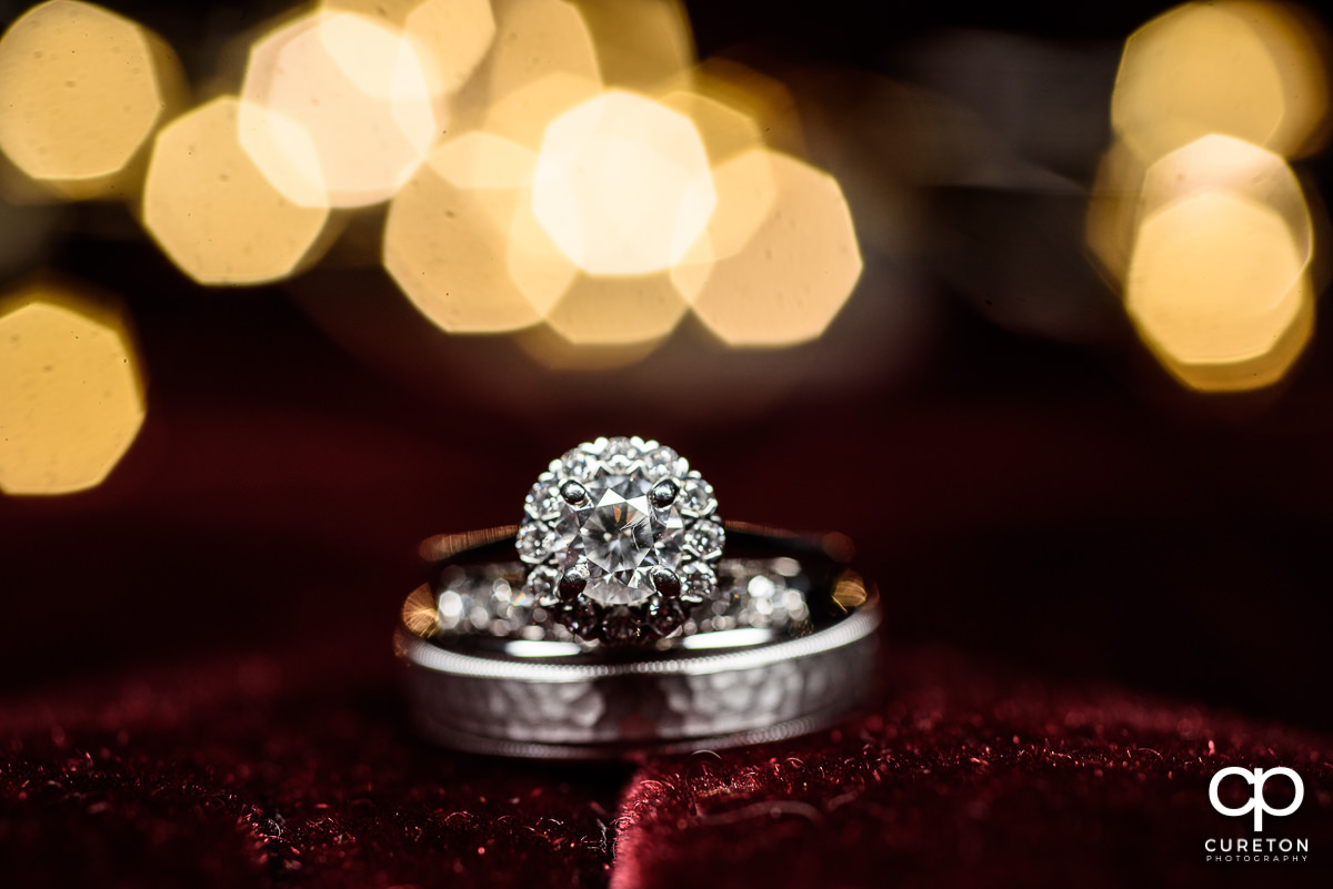 Wedding ring closeup on red velvet background.