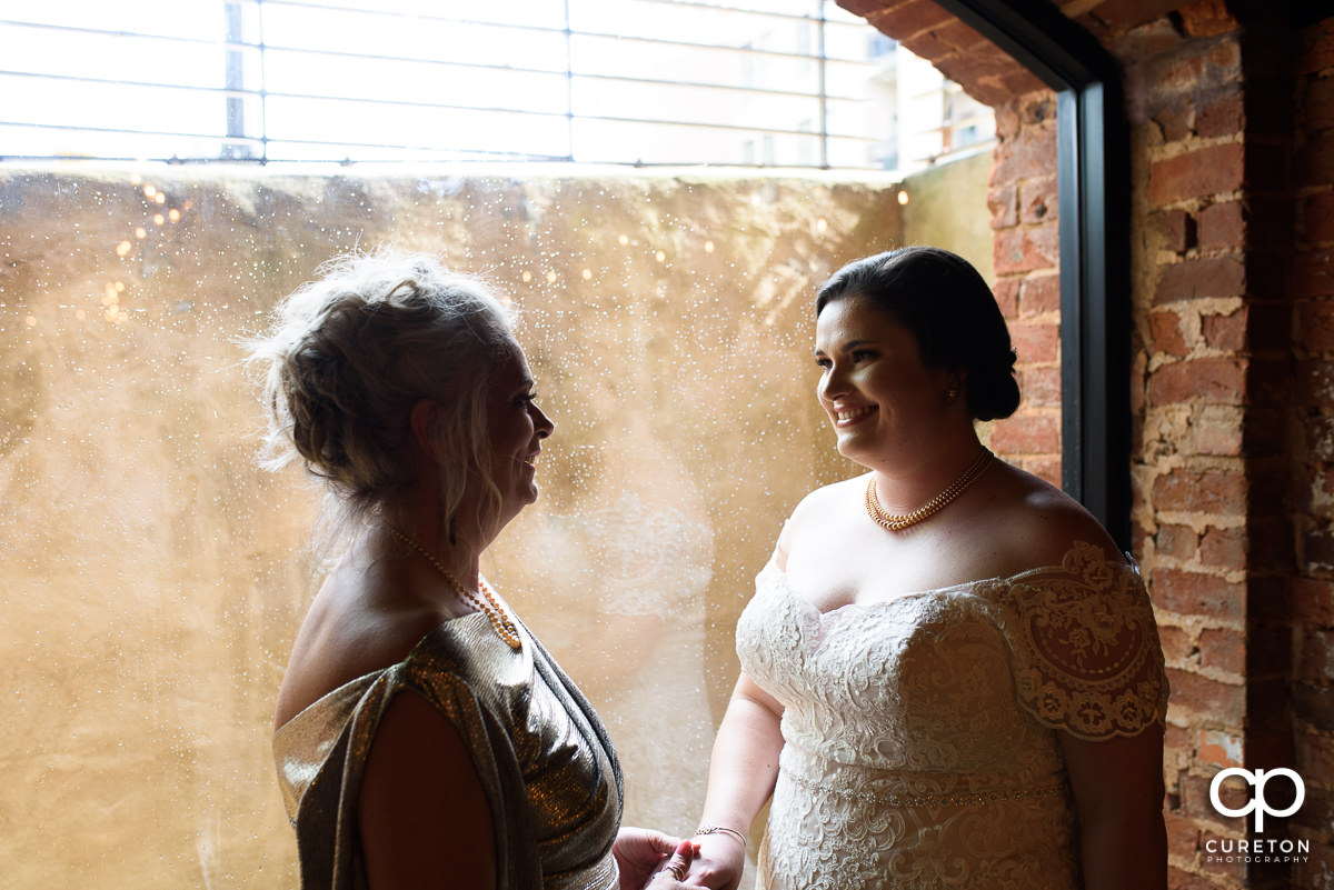 Bride having a moment with her mom.