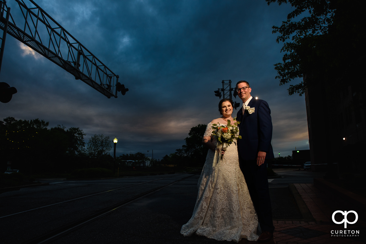 Bride and groom at sunset on Main Street in downtown Greenville,SC.