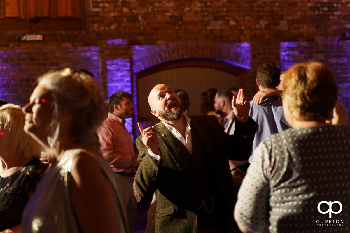 Wedding guests dancing at The Old Cigar Warehouse wedding reception.