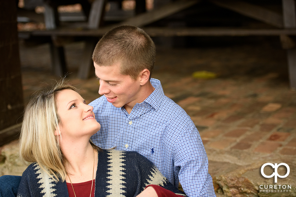 Couple looking at each other during their engagement session.