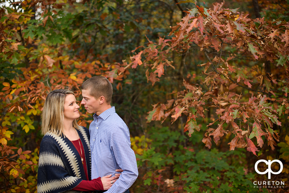 Engaged couple looking at each other.