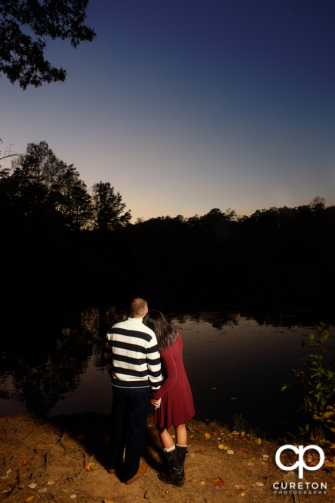 Bride and groom looking at the sunset.