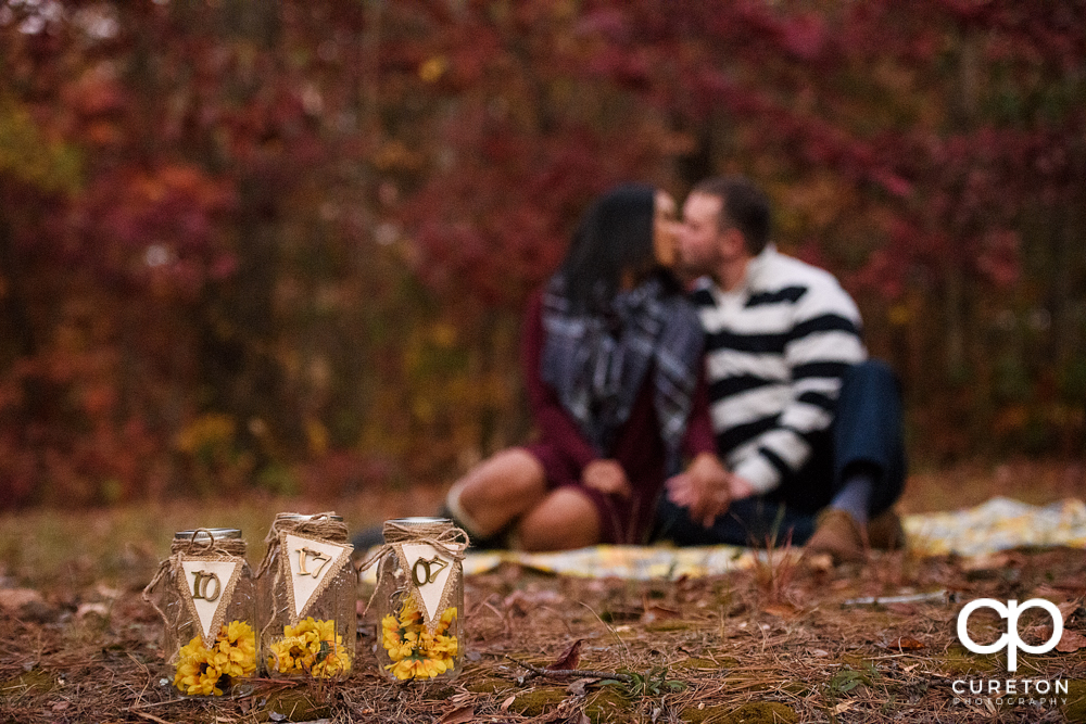 Fall save the date photo with the wedding date on Mason jars.