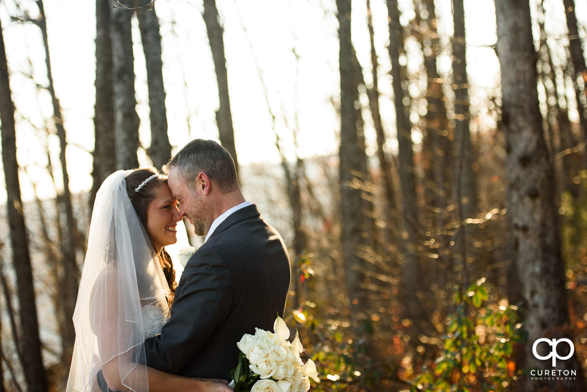 Bride and Groom in the woods after their wedding.