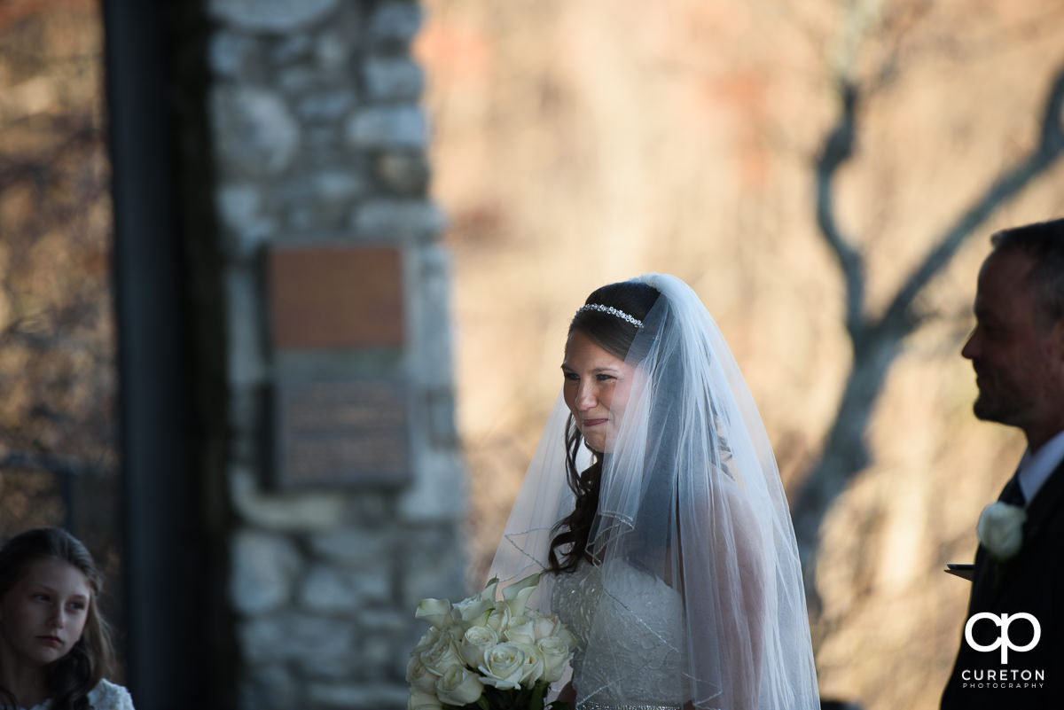 Bride smiling during the ceremony.