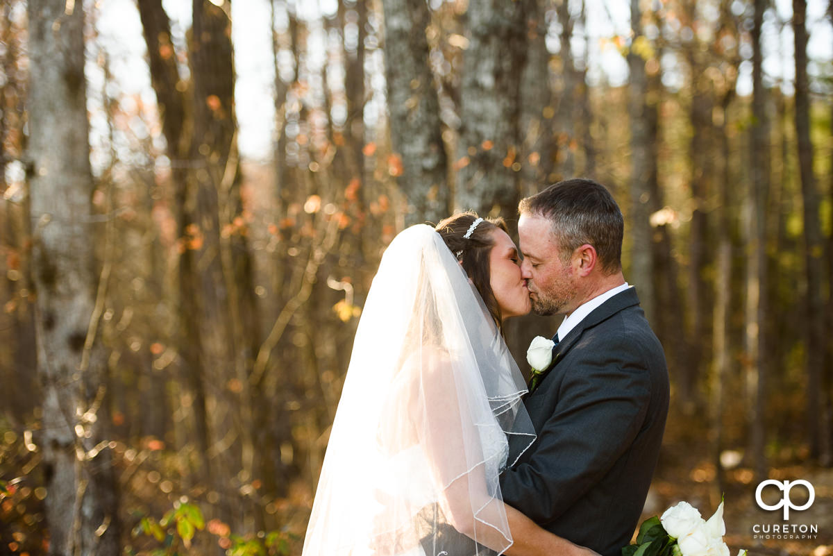 Bride and groom kissing at Pretty Place.