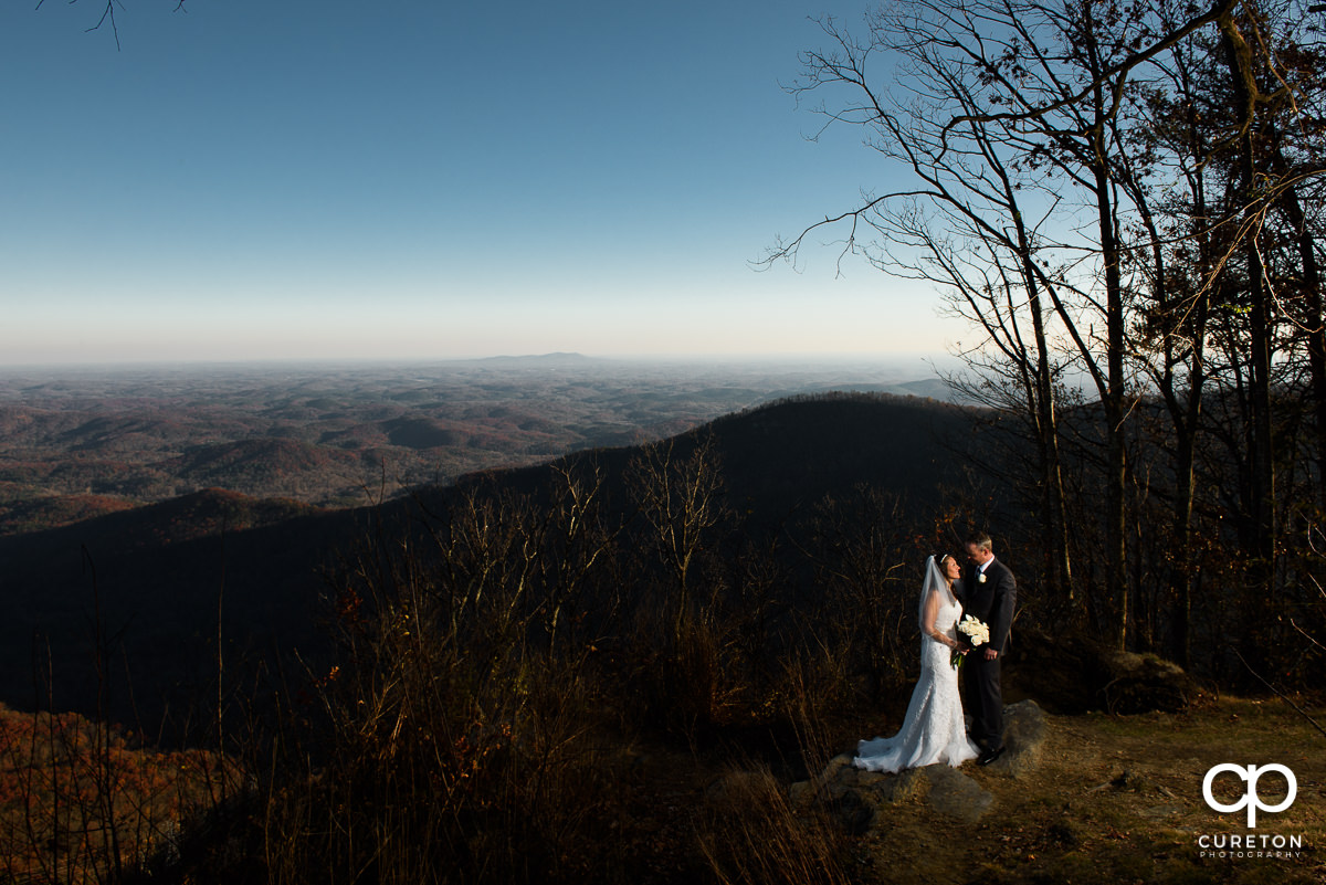 Bride and groom on a mountaintop at Pretty Place.
