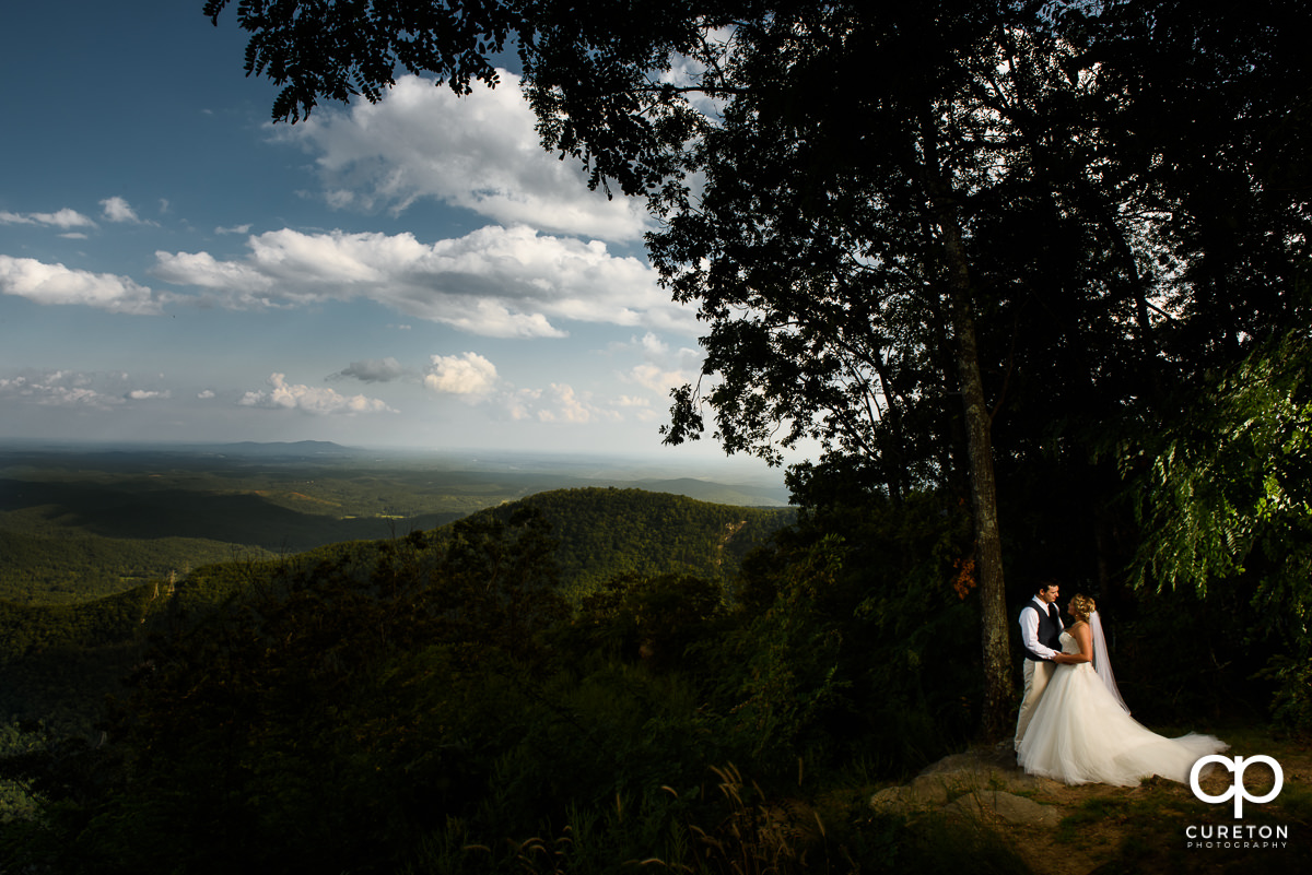 Bride and groom on a mountaintop after their wedding at Symmes Chapel, aka "Pretty Place".