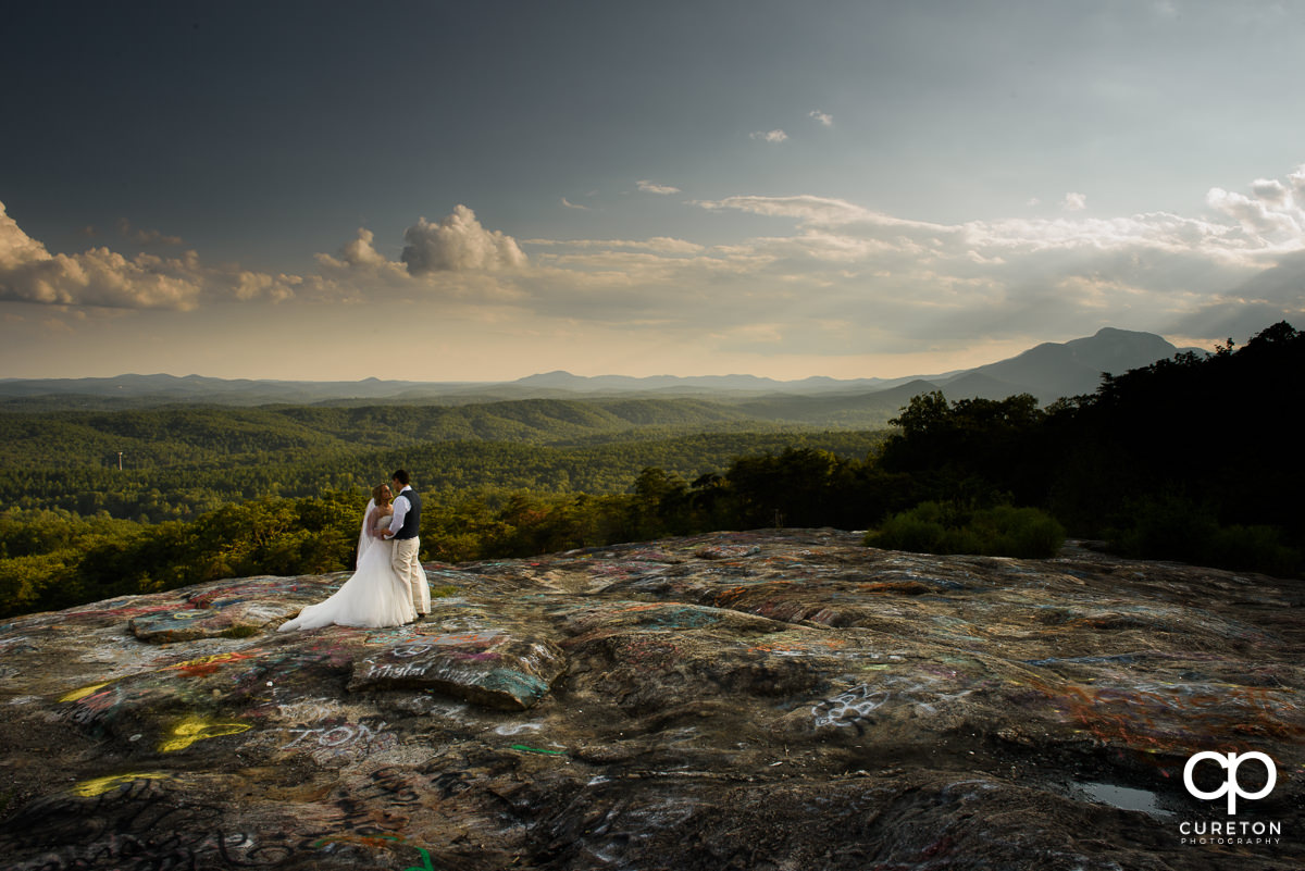 Bride and groom on Bald Rock after their wedding in the mountains.